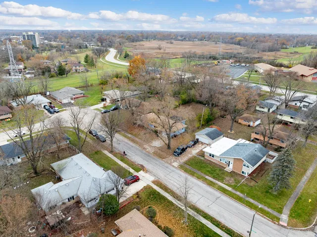 an aerial view of residential houses with outdoor space