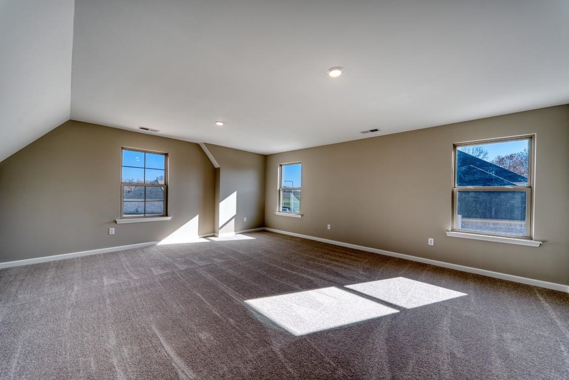 159 Como Lane Atoka, TN 38004 - Photo 21 of 38 a view of an empty room with window and wooden floor