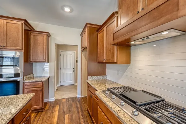 a kitchen with sink and cabinets