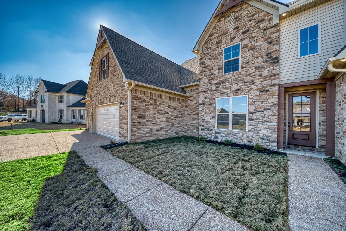 159 Como Lane Atoka, TN 38004 - Photo 30 of 38 a view of a brick house with a yard