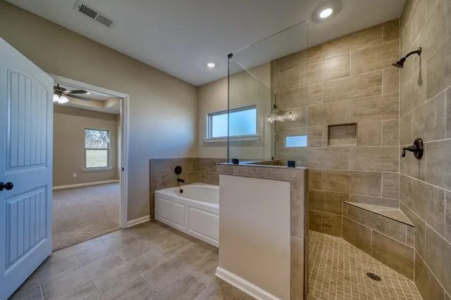 a kitchen with kitchen island granite countertop a sink and a stove