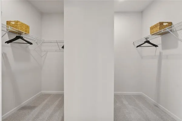 a spacious bathroom with a double vanity sink a mirror and a bathtub