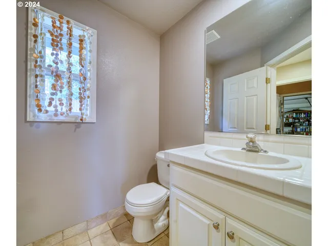 a bathroom with a shower and a sink