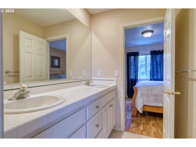 a bed room with a bed and a chair