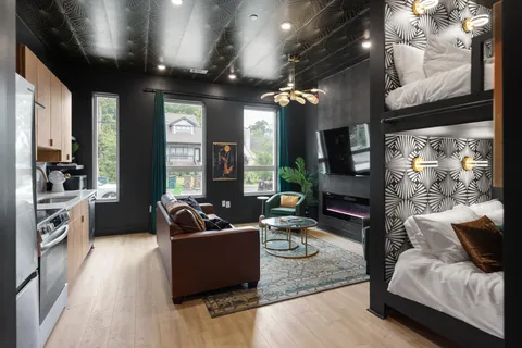 a living room with furniture and a large window