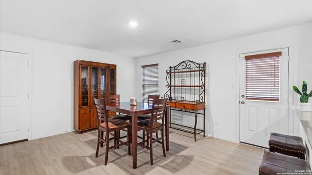 a view of a livingroom with furniture and wooden floor
