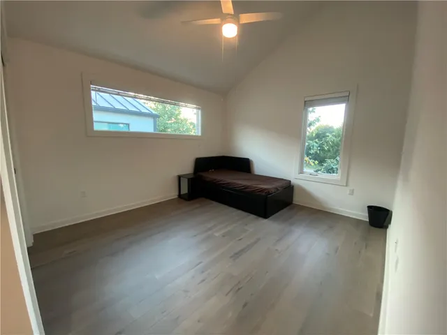 a bathroom with a granite countertop sink a toilet and a bathtub