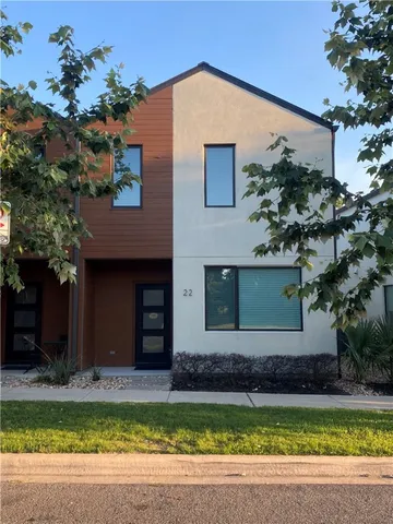 a view of a house with swimming pool and a yard
