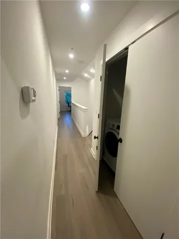 a view of an empty room with windows