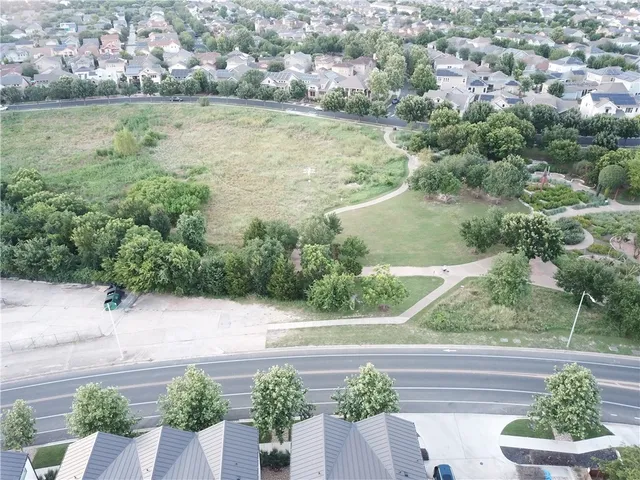 a white house that has a tree in front of it