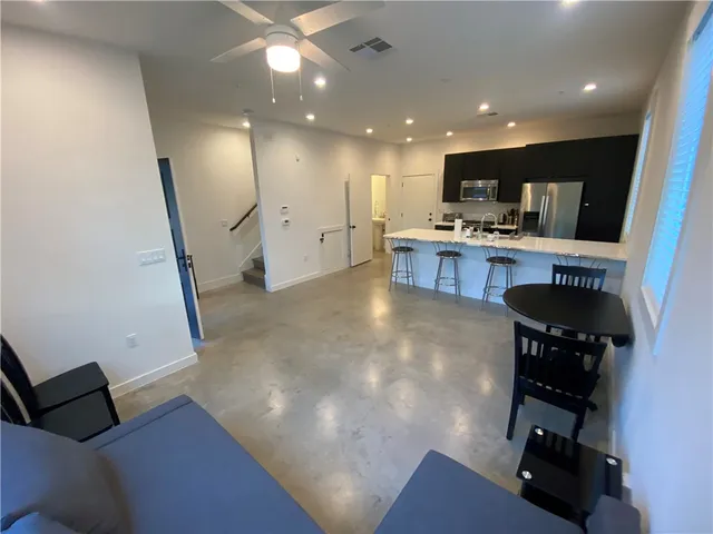 a kitchen with a sink and a refrigerator