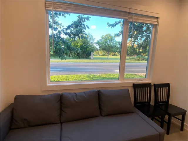 a kitchen with kitchen island sink and mirror