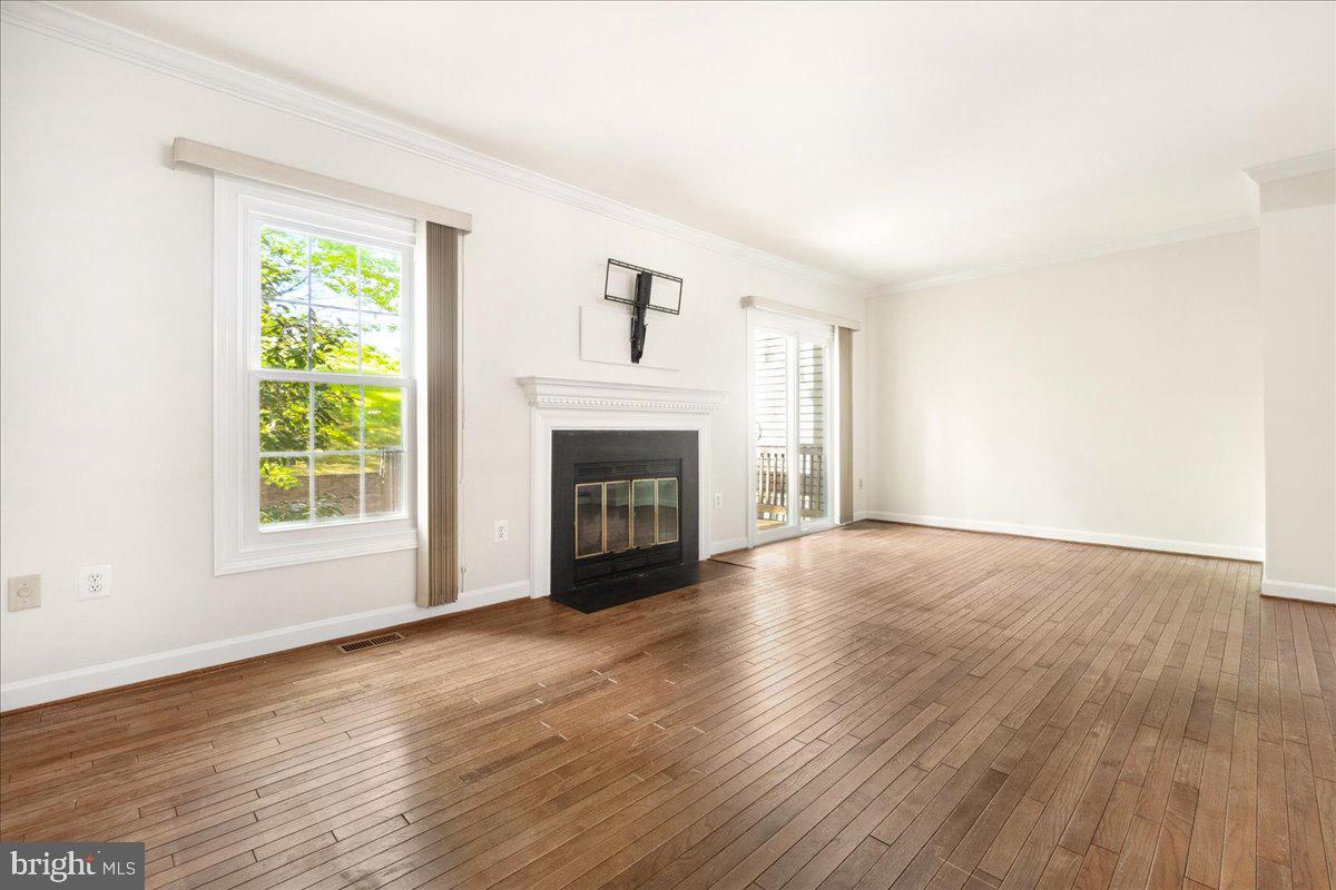 5598 Rivendell Place Frederick, MD 21703 - Photo 12 of 49 Living Room + Entry to Deck