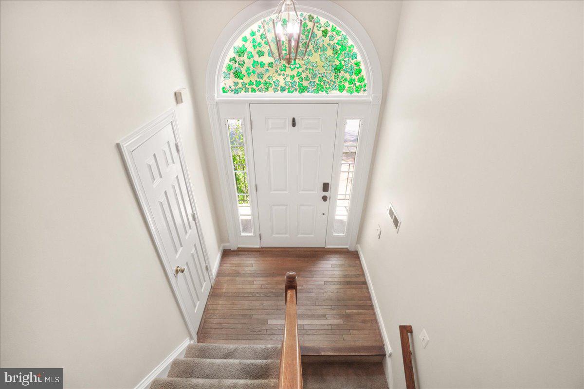 5598 Rivendell Place Frederick, MD 21703 - Photo 5 of 49 Entryway with Half Bath as soon as you enter