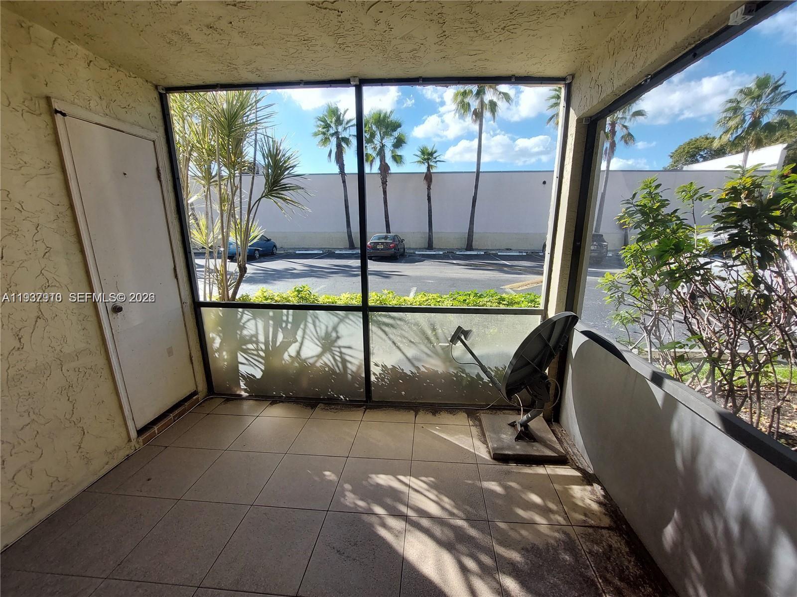 253 South Cypress Road, Unit 206 Pompano Beach, FL 33060 - Photo 11 of 30 a view of an entryway with a floor