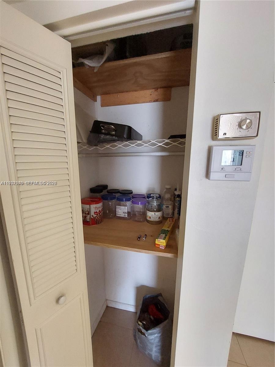 253 South Cypress Road, Unit 206 Pompano Beach, FL 33060 - Photo 17 of 30 a refrigerator freezer sitting inside of a kitchen