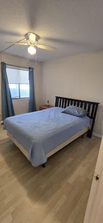 a living room with a washing machine and a sink