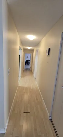 a bedroom with a bed a table and chair