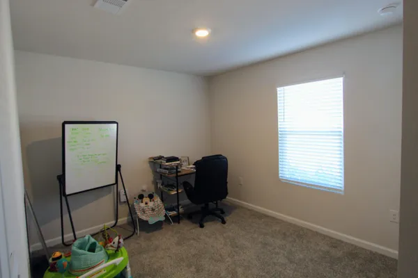 a room with furniture and a window