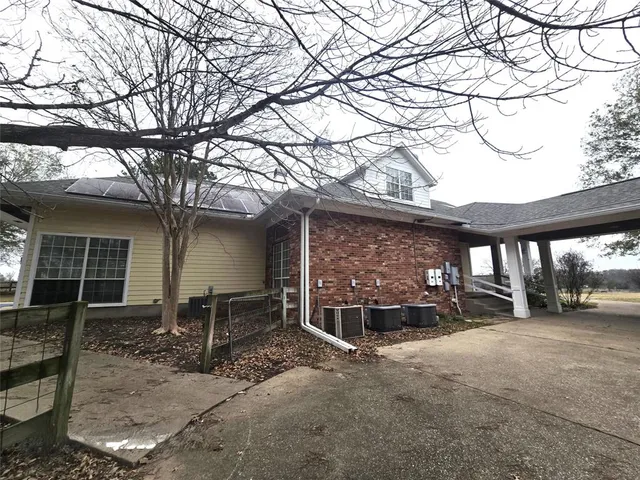 a front view of a house with parking area