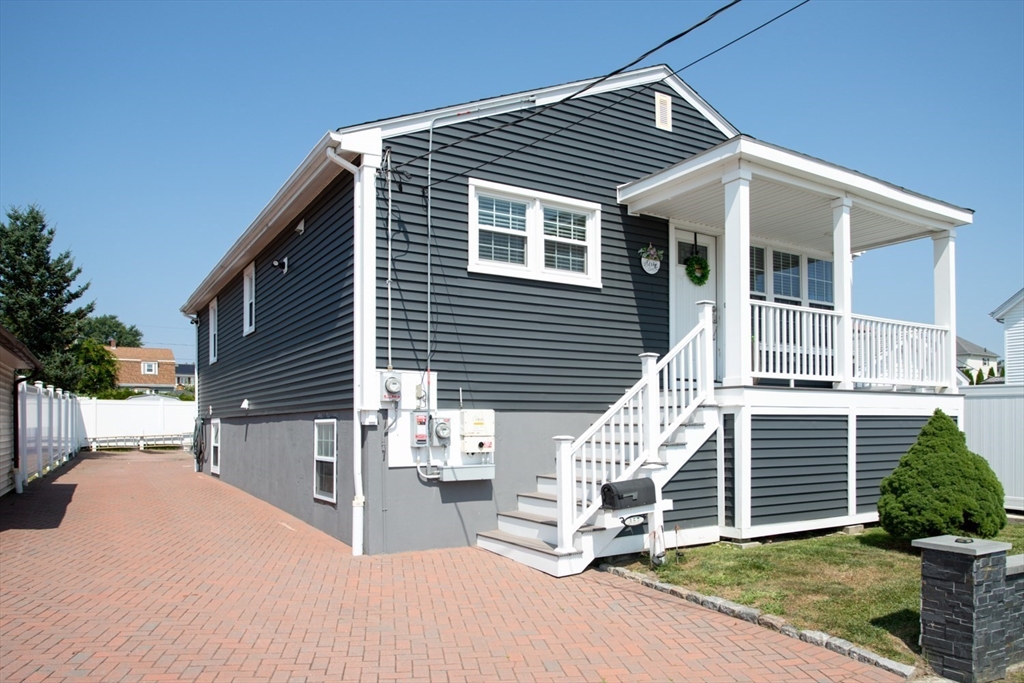 357 Baker Street Fall River, MA 02721 - Photo 1 of 31 a view of a house with a yard
