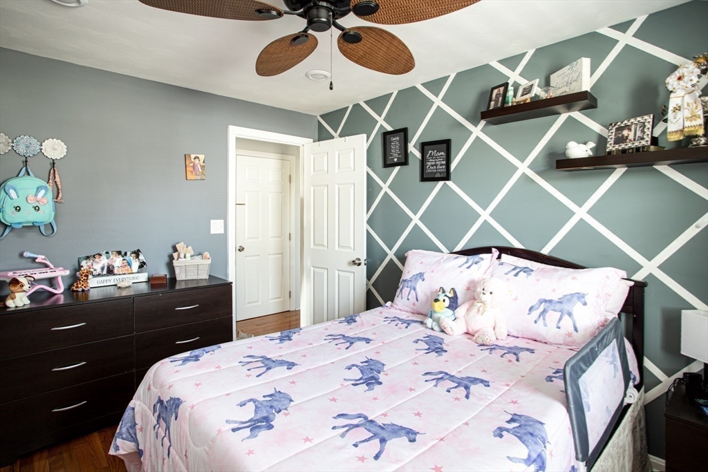 357 Baker Street Fall River, MA 02721 - Photo 14 of 31 a bedroom with a bed and lamp on dresser
