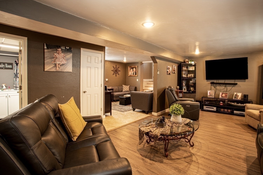 357 Baker Street Fall River, MA 02721 - Photo 20 of 31 a living room with furniture and a flat screen tv