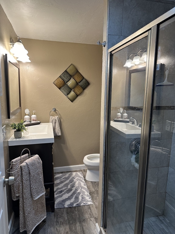 357 Baker Street Fall River, MA 02721 - Photo 21 of 31 a bathroom with a sink and a mirror
