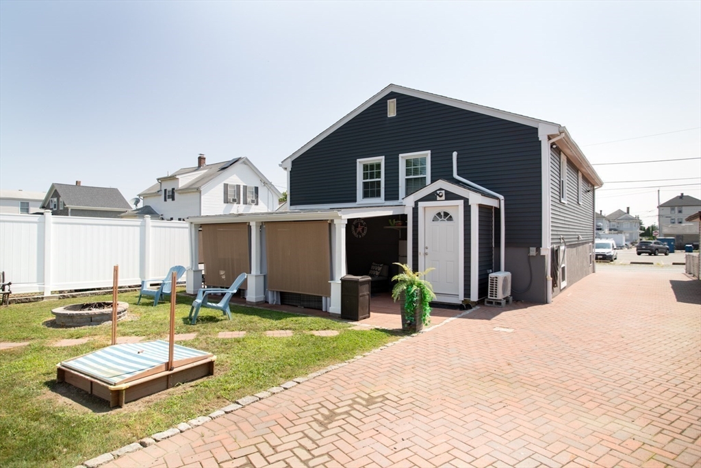 357 Baker Street Fall River, MA 02721 - Photo 28 of 31 a front view of a house with a yard