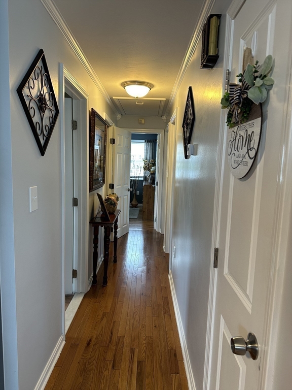 357 Baker Street Fall River, MA 02721 - Photo 7 of 31 a view of a hallway with wooden floor and stairs