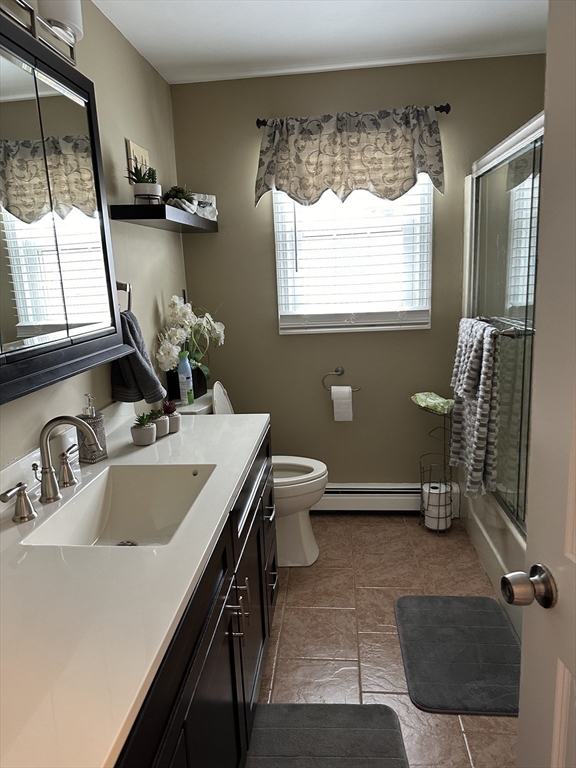 357 Baker Street Fall River, MA 02721 - Photo 8 of 31 a bathroom with a sink and a mirror