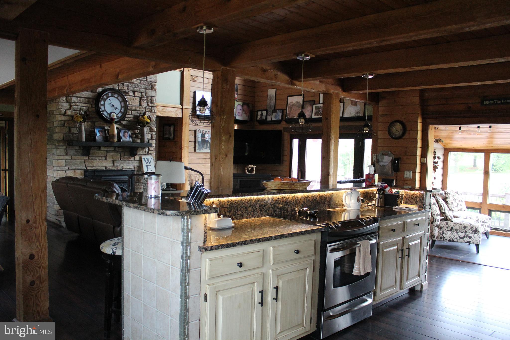 170 Heilig Road Sewell, NJ 08080 - Photo 21 of 54 a kitchen with granite countertop a sink stove and cabinets