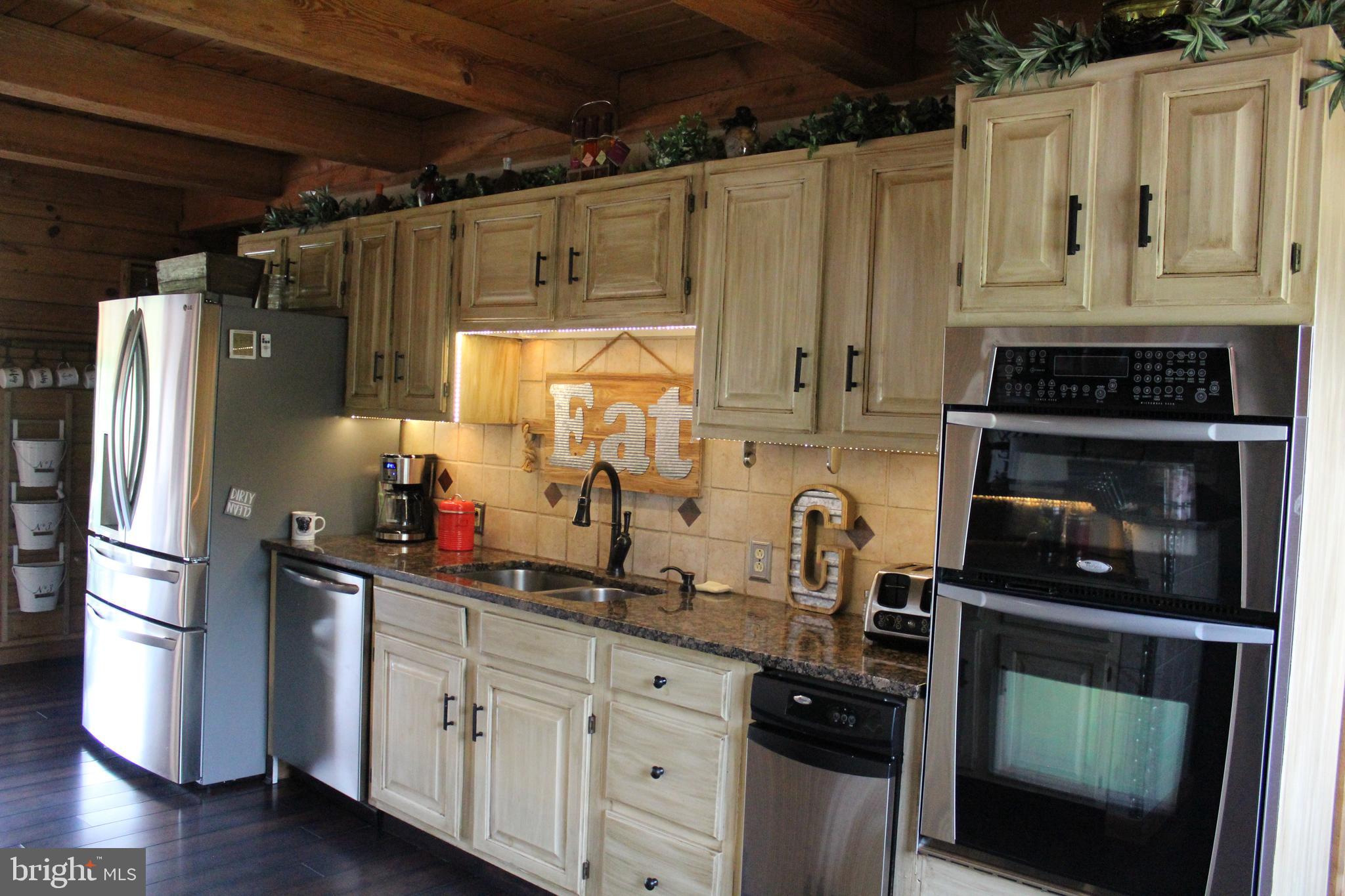 170 Heilig Road Sewell, NJ 08080 - Photo 22 of 54 a kitchen with granite countertop a refrigerator stove and sink