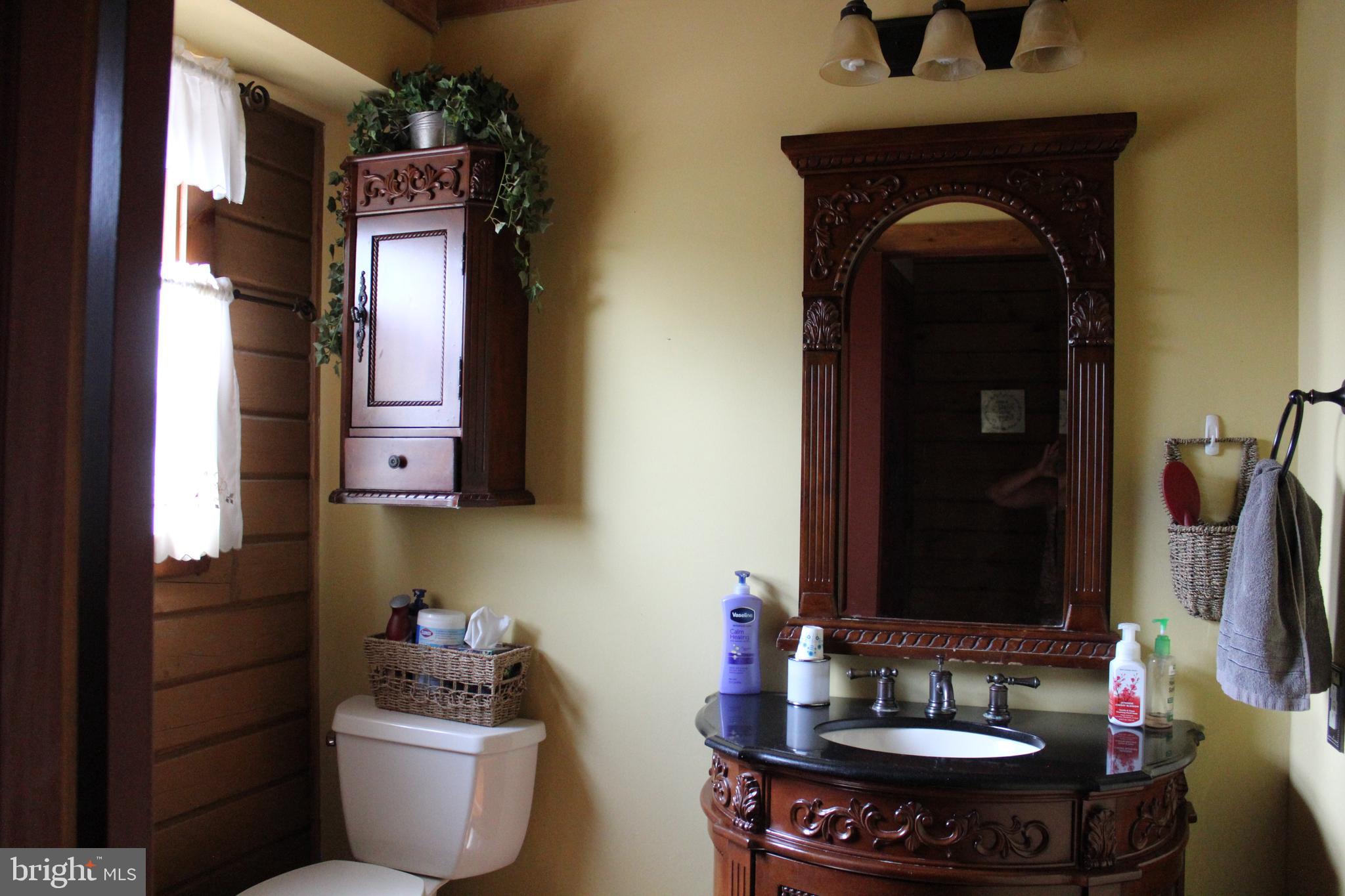 170 Heilig Road Sewell, NJ 08080 - Photo 27 of 54 a bathroom with a sink and a mirror