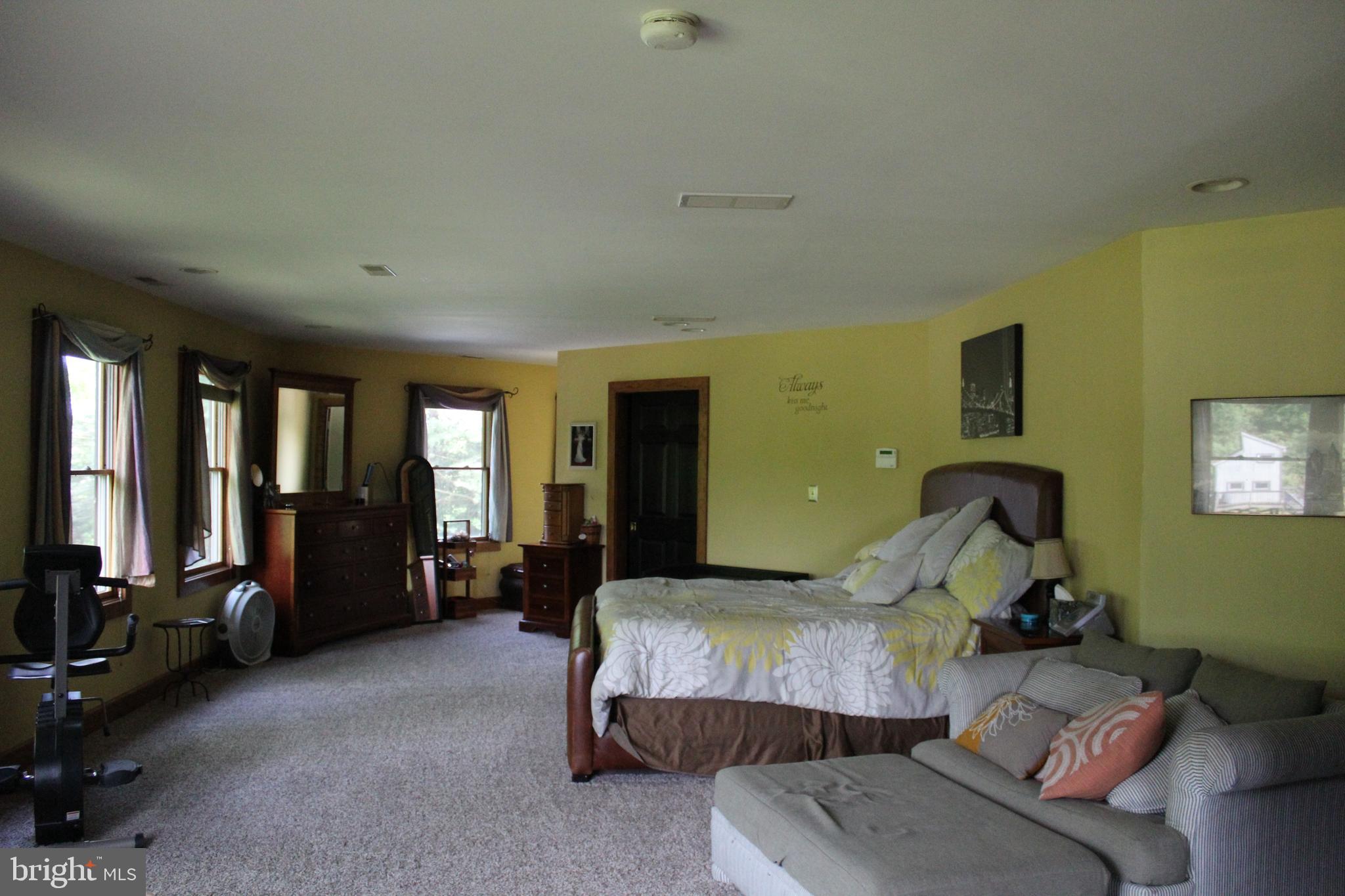 170 Heilig Road Sewell, NJ 08080 - Photo 28 of 54 a bedroom with a bed and large windows