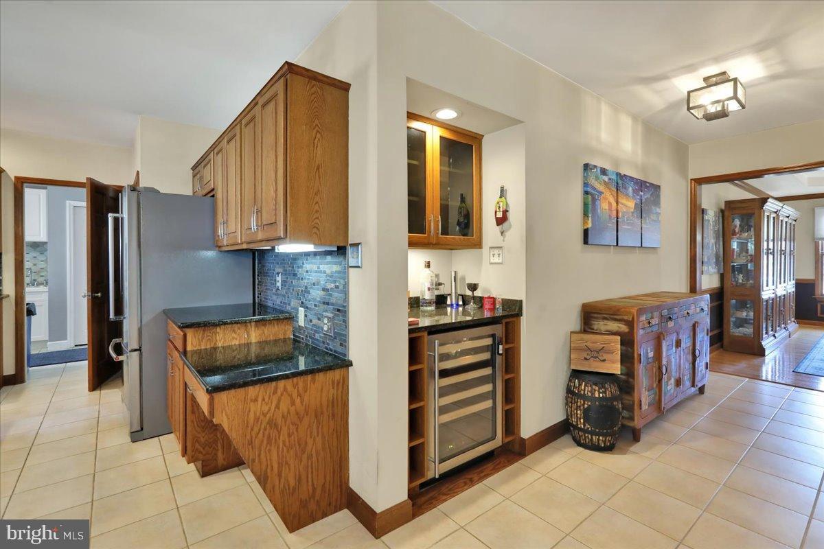 23 Laura Court Sinking Spring, PA 19608 - Photo 12 of 67 a kitchen with furniture and a refrigerator