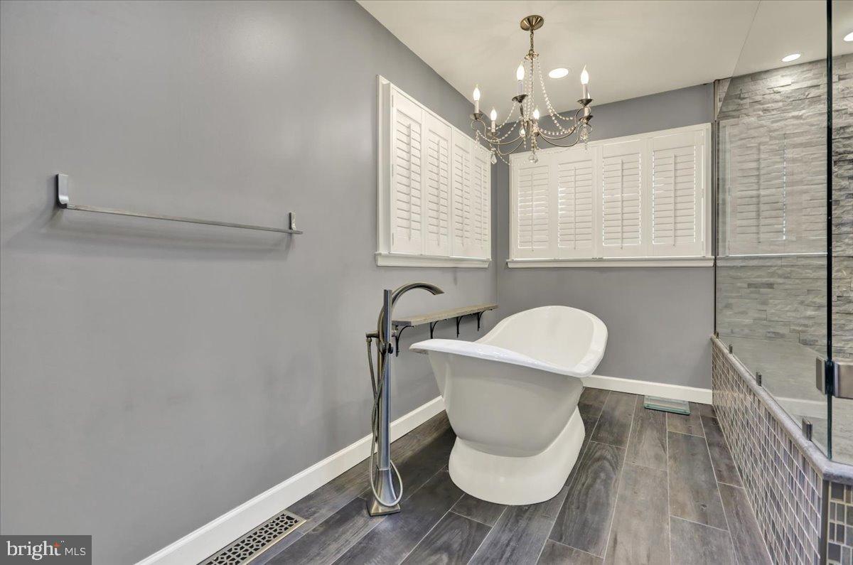 23 Laura Court Sinking Spring, PA 19608 - Photo 35 of 67 a bathroom with a toilet a sink and a mirror