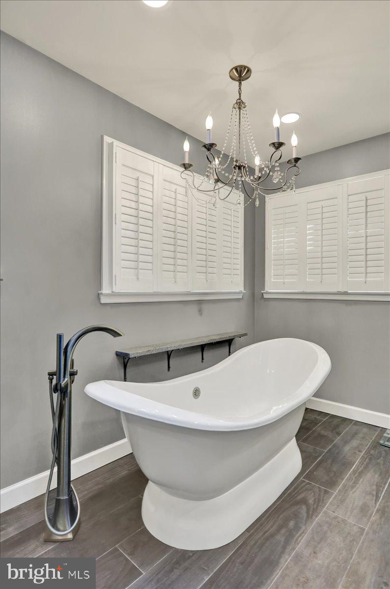 23 Laura Court Sinking Spring, PA 19608 - Photo 38 of 67 a white bath tub sitting in a bathroom next to a window