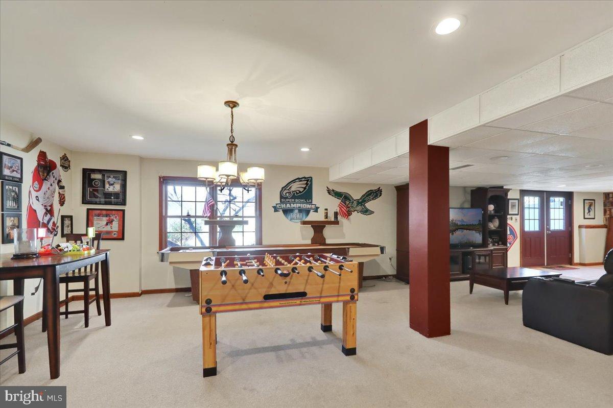 23 Laura Court Sinking Spring, PA 19608 - Photo 51 of 67 Inviting game room with sports memorabilia.