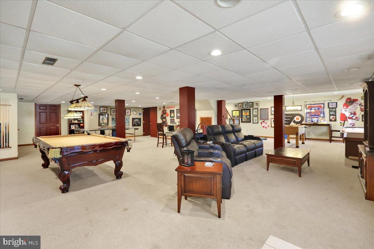 23 Laura Court Sinking Spring, PA 19608 - Photo 54 of 67 a living room with furniture and a table