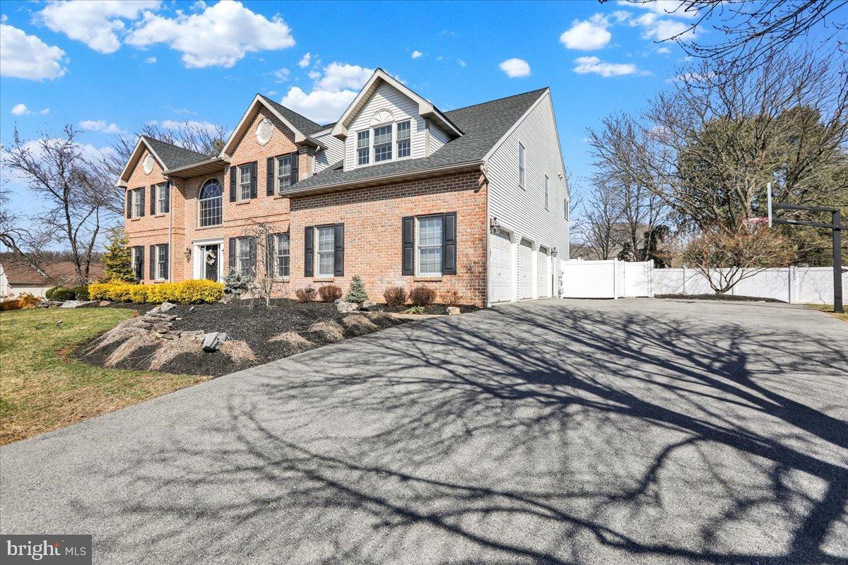 23 Laura Court Sinking Spring, PA 19608 - Photo 63 of 67 a view of a large white house with a snow on the road