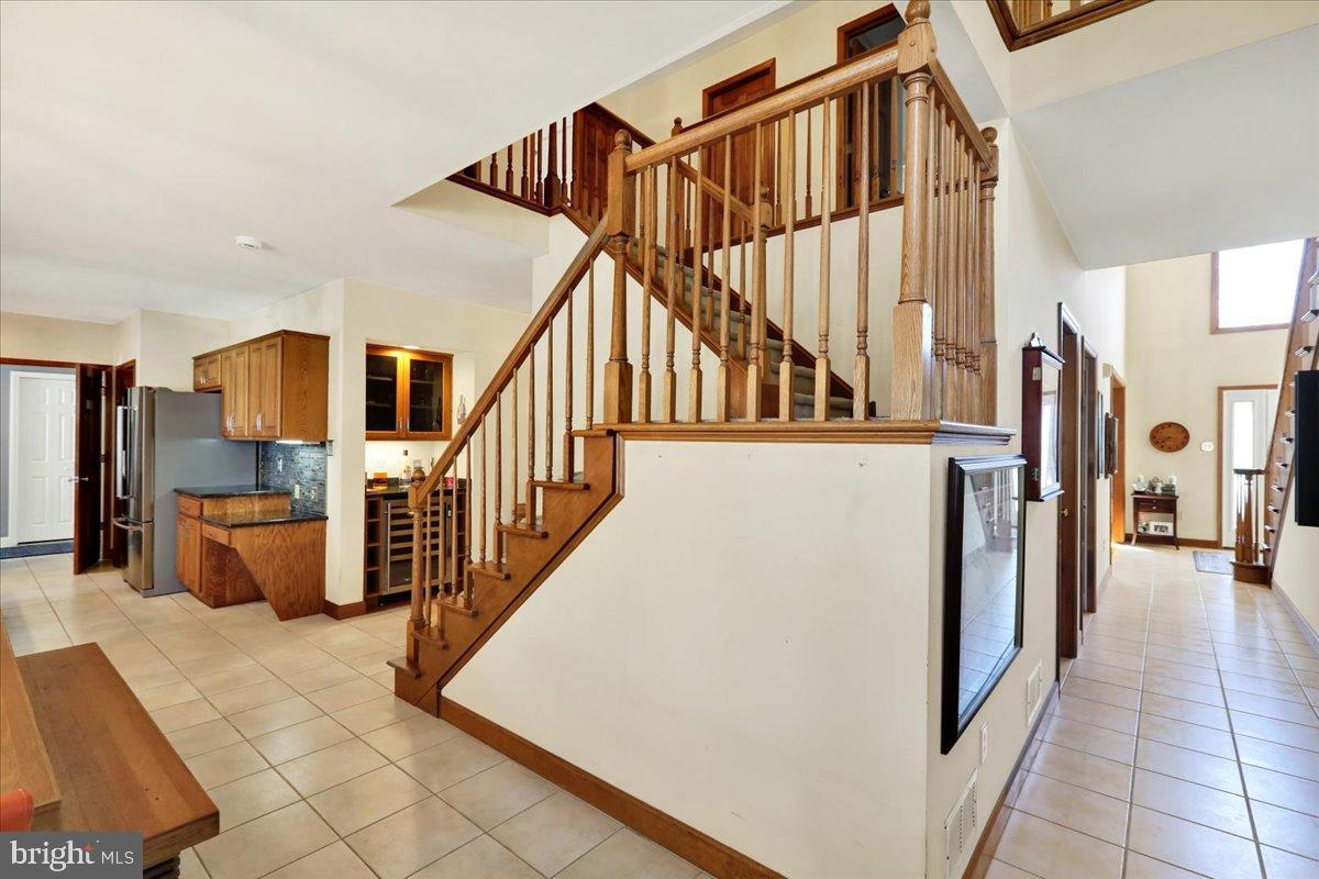 23 Laura Court Sinking Spring, PA 19608 - Photo 8 of 67 Inviting entryway with elegant staircase.