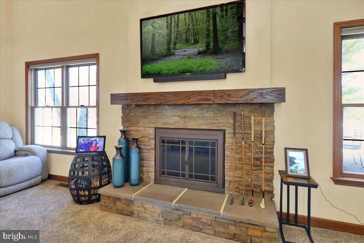 23 Laura Court Sinking Spring, PA 19608 - Photo 10 of 67 a living room with furniture a window and a fireplace
