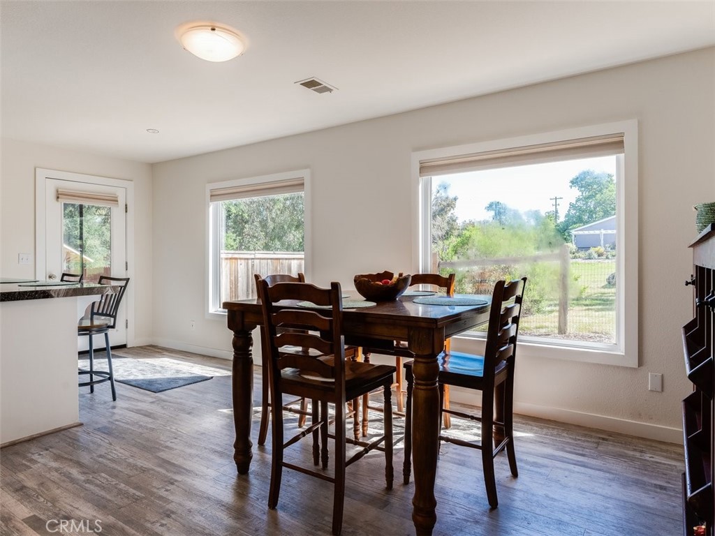 8370 Prado Lane Atascadero, CA 93422 - Photo 18 of 54 a view of a dining room with furniture window and wooden floor