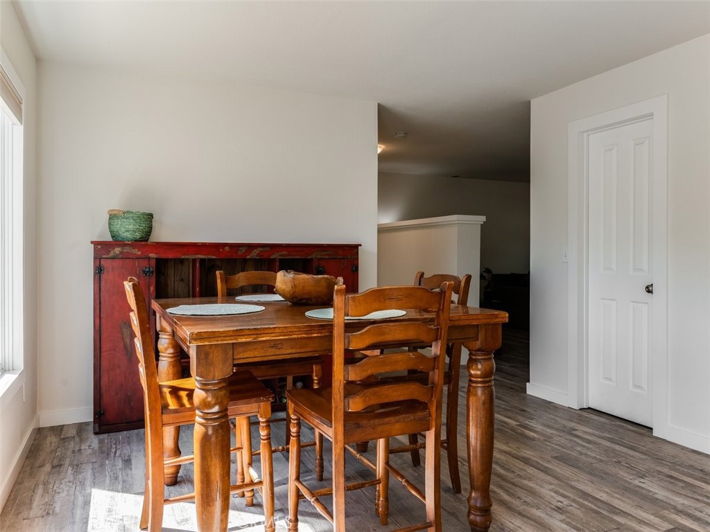 8370 Prado Lane Atascadero, CA 93422 - Photo 19 of 54 a view of a dining room with furniture and wooden floor