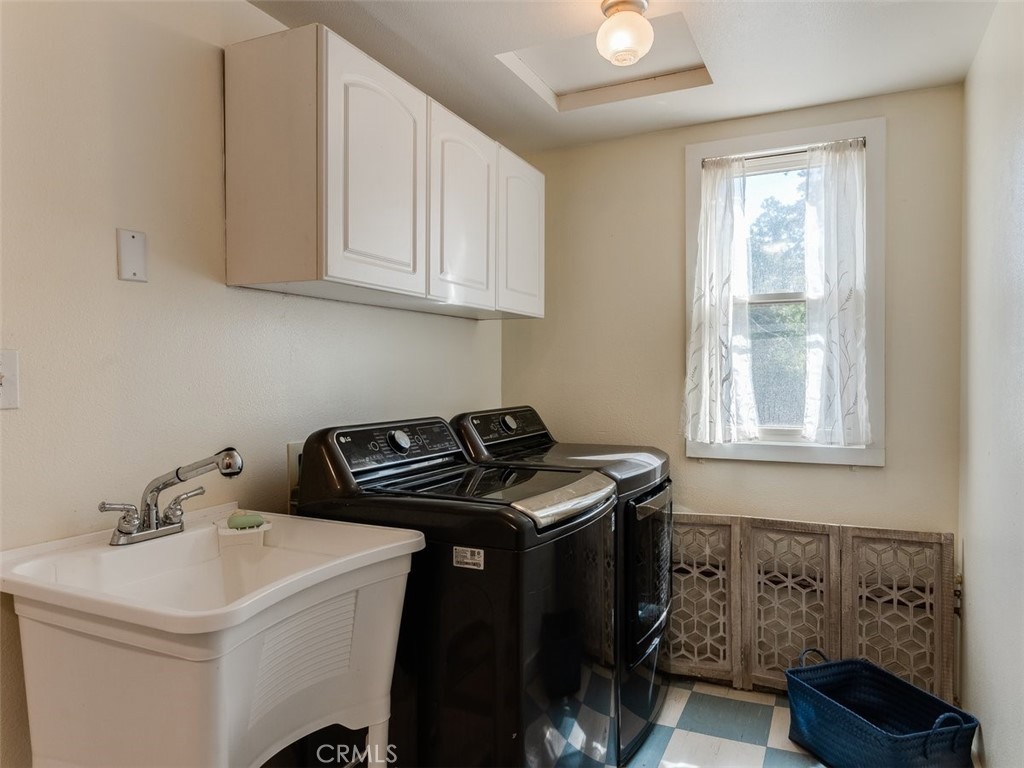 8370 Prado Lane Atascadero, CA 93422 - Photo 21 of 54 a bathroom with a sink a vanity and a window