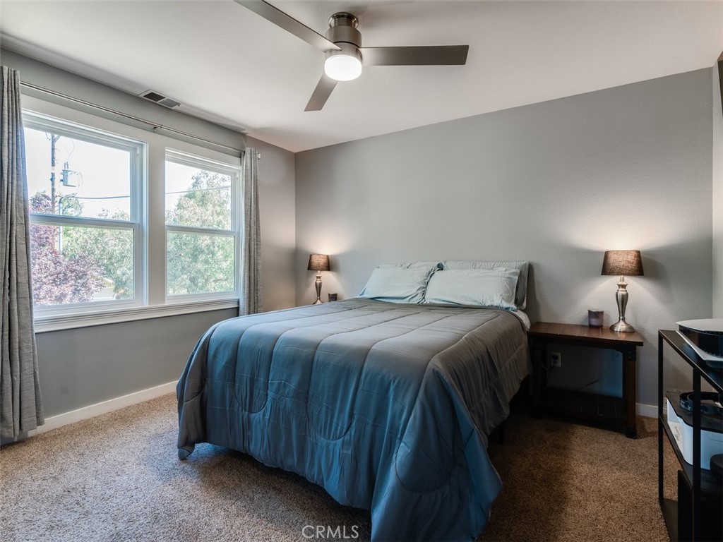 8370 Prado Lane Atascadero, CA 93422 - Photo 24 of 54 a bedroom with a bed and a window