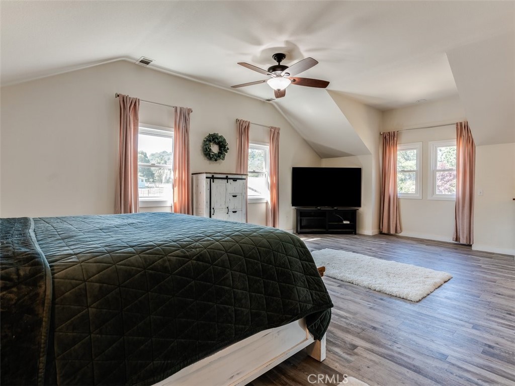 8370 Prado Lane Atascadero, CA 93422 - Photo 28 of 54 a bedroom with a bed and a flat screen tv