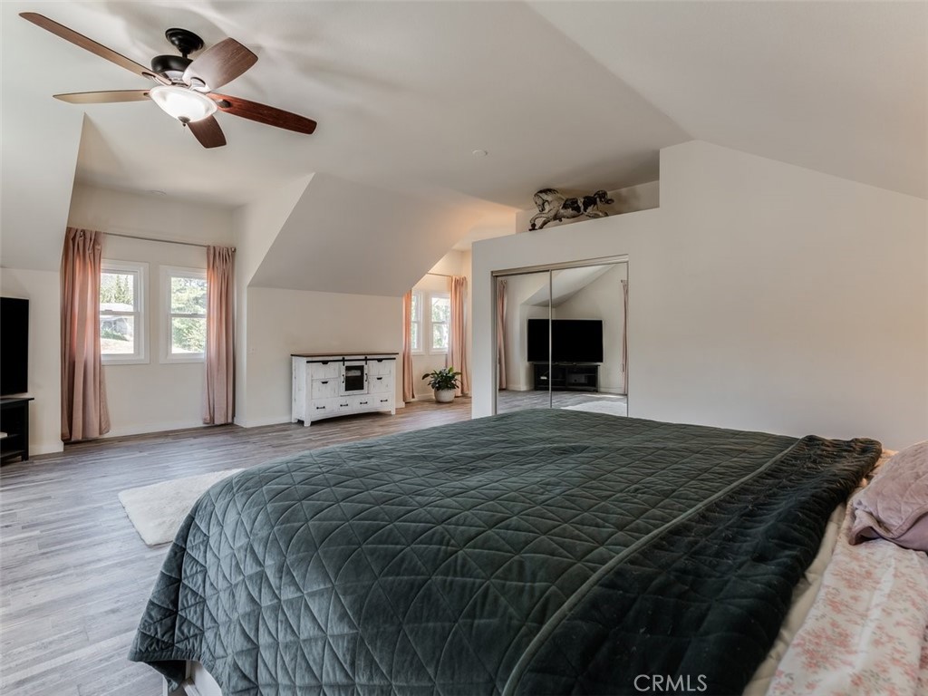 8370 Prado Lane Atascadero, CA 93422 - Photo 29 of 54 a bedroom with a bed and a fireplace
