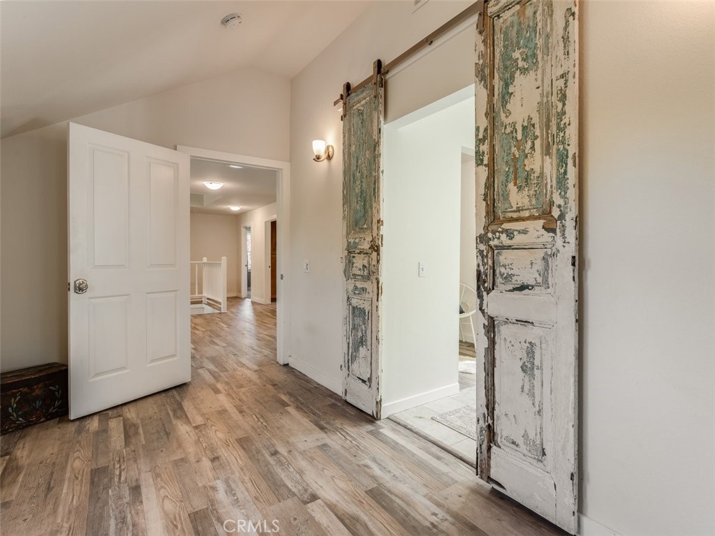 8370 Prado Lane Atascadero, CA 93422 - Photo 30 of 54 a view of a hallway with wooden floor